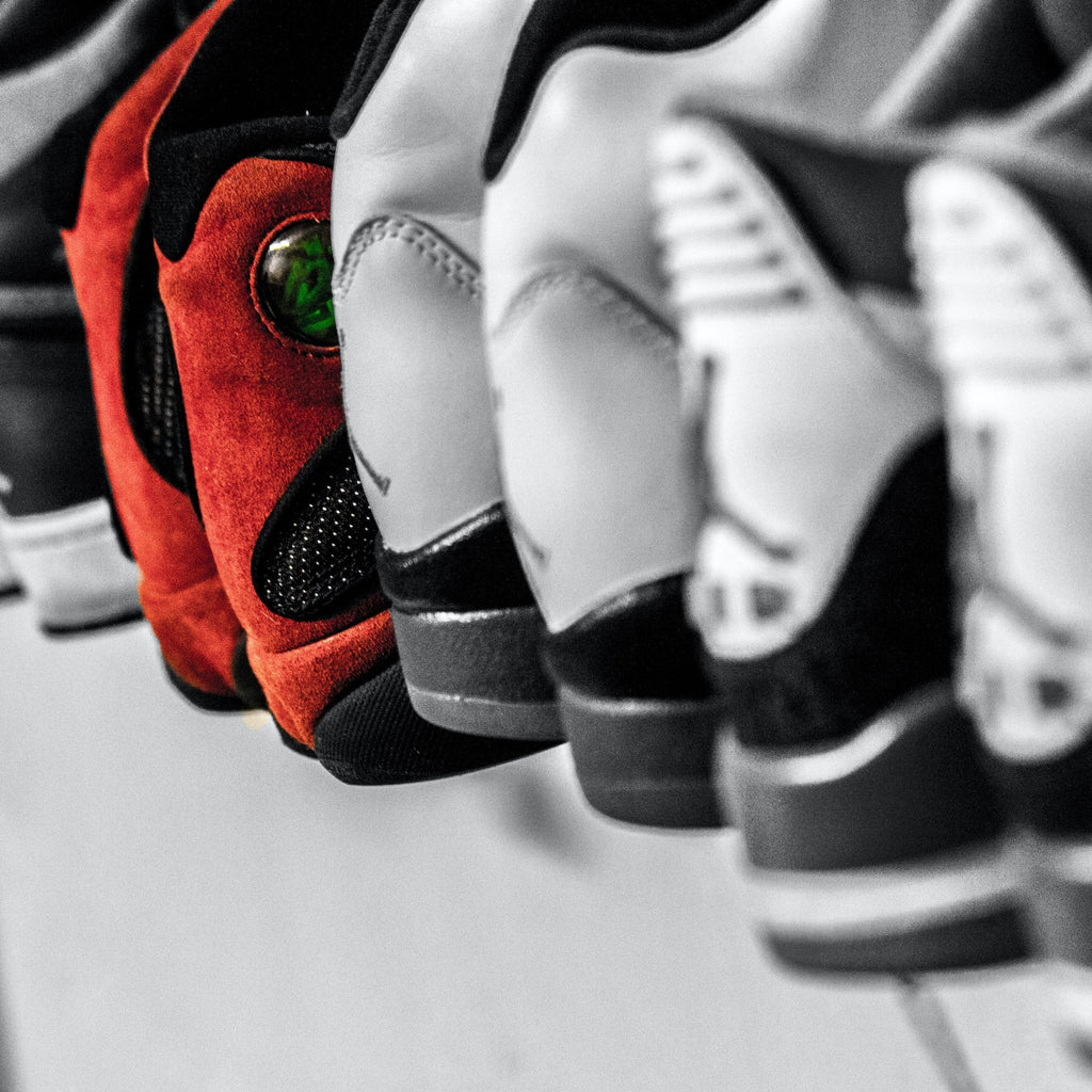 Jordans on shelf - photo by Hermes Rivera